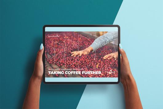 Hands holding Tablet with Beyers Sustainablity Report 2023